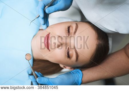 Relaxed Woman Is Visiting Dentist Stock Photo