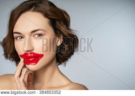 Charming Young Woman Using Crystal Collagen Lip Patch