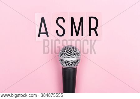 A Microphone And Letters Asmr On Pink Background. Minimal Compostion.