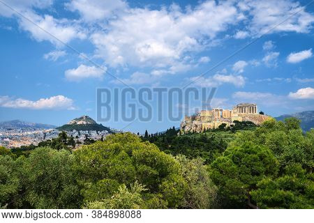 Iconic View Of Acropolis Hill And Lycabettus Hill In Background In Athens, Greece From Pnyx Hill In 