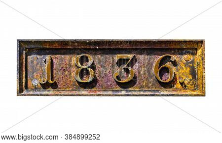 Rusty Metal Plate With 1836 Date Of Built Of Old Napoleon Fortress On White Plaster