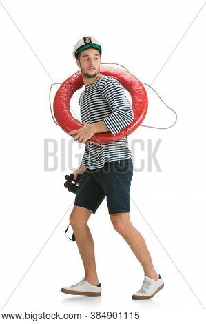 Holding Lifeline And Binocular. Caucasian Male Sailor In Uniform On White Background. Young Man Usin