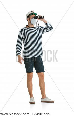 Prevention. Caucasian Male Sailor In Uniform On White Studio Background. Young Man Using Modern Devi