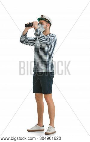 Prevention. Caucasian Male Sailor In Uniform On White Studio Background. Young Man Using Modern Devi