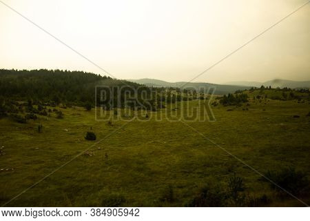 Empty Fields After Rain And During Sunset, Atmospheric Photo Of A Meadow In Montenegro