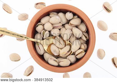 Pistachios In White Porcelain Bowls. Roasted Pistachio Seeds In Shells And Shelled. Green, Dried Fru