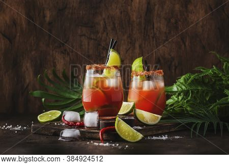 Michelada - Mexican Inspired Bloody Mary Alcoholic Cocktail With Beer, Lime Juice, Tomato Juice, Spi