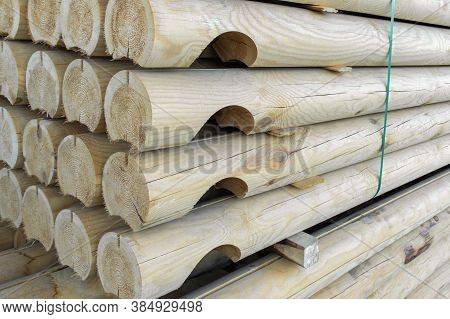 Wooden Balk, Timber, Beam And Building Material Stacked At Construction Site. Wooden Planks, Lining,