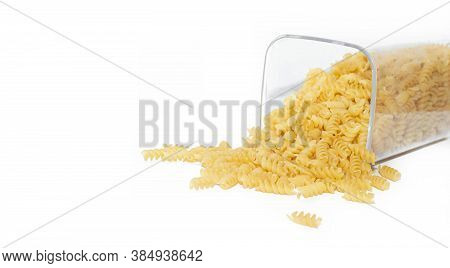 Fusilli Macaroni Placer . Macaroni Spills Out Of The Jar. Article About Pasta. Isolated Background. 