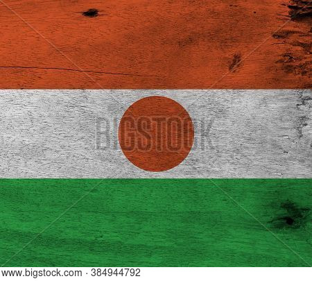 Flag Of Niger On Wooden Plate Background. Grunge Nigerien Flag Texture, Orange White And Green; Char