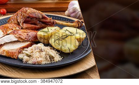 Roasted Turkey Served On A Plate With Farofa, Crumbs And Boiled Potatoes. Thanksgiving Day And Chris