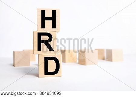 Human Resource Development. Hrd The Word On Wooden Cubes, Cubes Stand.business And Finance Concept