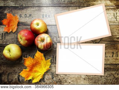 Home Background With Apples, Photo Frames And Wood Texture. Free Space For Your Design And Home Inte
