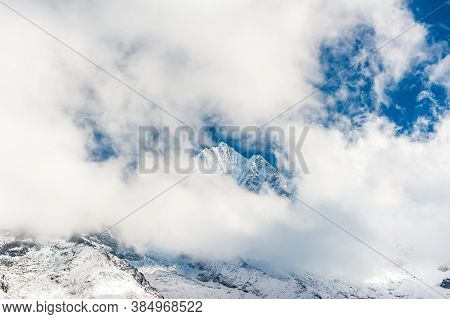 Fresh Snow On The Top Of Mount Kangtega Peak Hidden In Clouds. Trekking In Nepal Himalayas. Ebc (eve