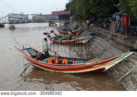 Yangon, Myanmar, Feb 24, 2019: Myanmar Traditional Ferry Landing And Waiting Passenger At Yangon Riv
