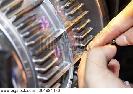 Close Up Hand Of Operator Use A Diamond File Or Equipment To Polish And Decorate Blade Of Roller Die