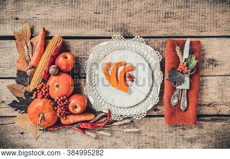 Autumn Table Setting, Menu Composition, Vintage Cutlery, Sliced Pumpkin. Thanksgiving Food, Healthy 