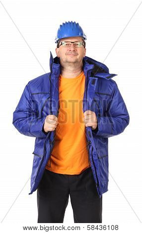 Man in winter workwear and hard hat. Portrait.