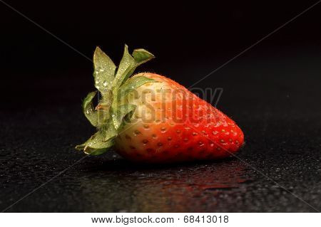 Frech Strawberries With Leaves On Black Background