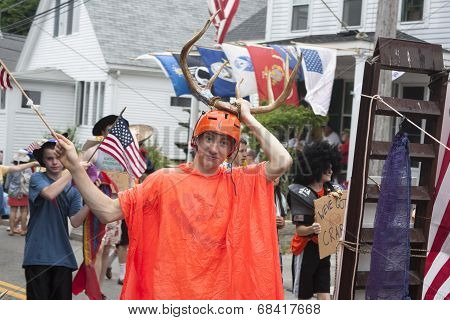 Man walking in the Wellfleet 4th of July Parade in Wellfleet, Massachusetts.