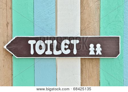 Toilet Sign On Colorful Wall