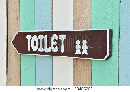 Toilet Sign On Colorful Wall