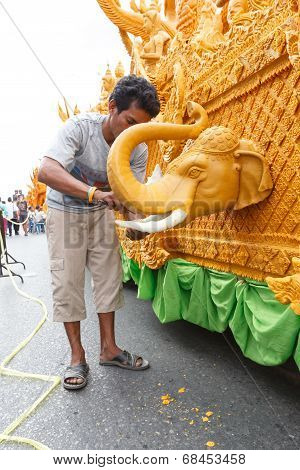 Thai people candle Carver on the traditional candle procession festival of Buddha.