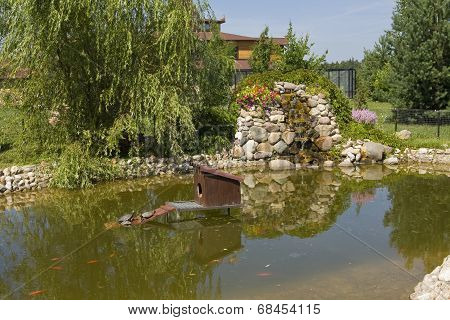 Waterfall And Pond In Garden