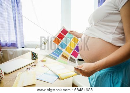 Pregnant woman working from home