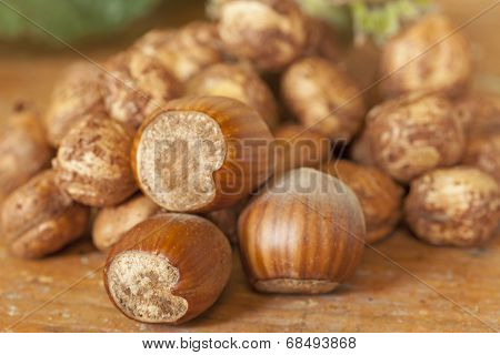 Hazelnut shells on wooden table top