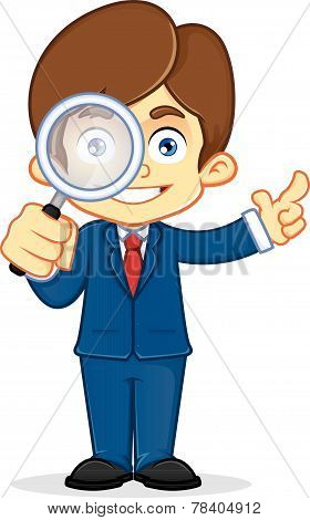 Businessman holding magnifying glass