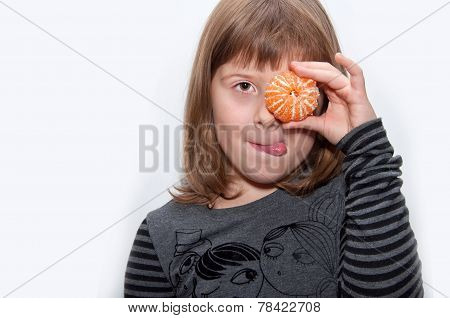 Teen Girl With Mandarin Shows Tonque