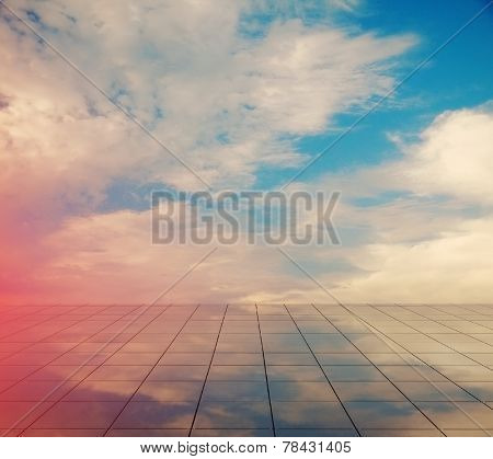 blue sky and miror floor, cloudy background, retro film filtered, instagram style 