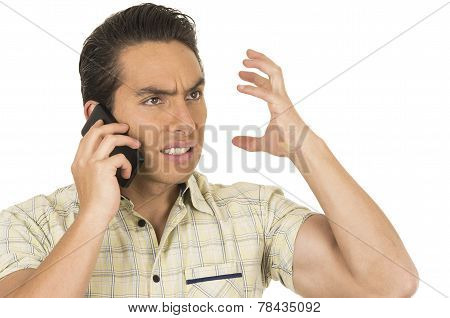 young handsome hispanic man posing using cell phone