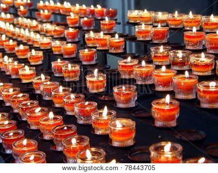 Red Candles In A Curch
