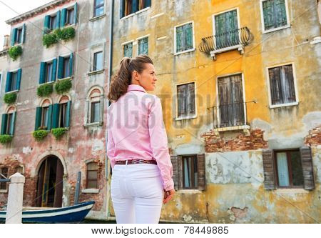 Young Woman In Venice, Italy Against Old Buldings