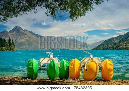 Yellow And Green Pedalo On Lake