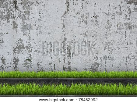 Green grass on wooden panels in front of concrete wall