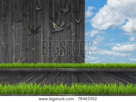 Dark wood wall and floor with grass