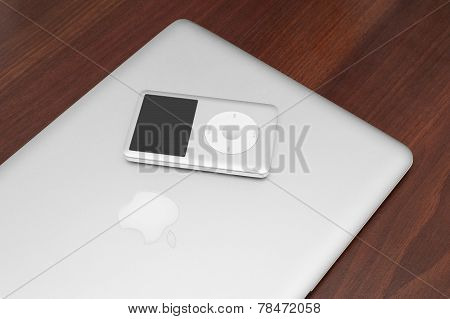 Ipod Classic 160 Gb On Silver Macbook. Studio Shot.