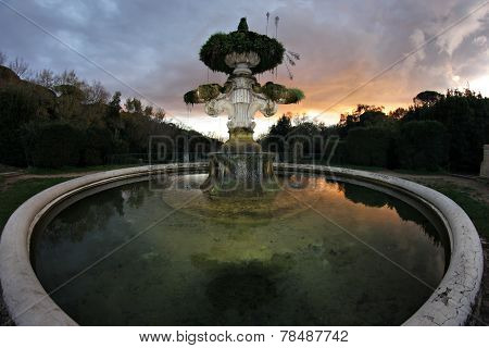 Italian Garden Fountain At Dusk