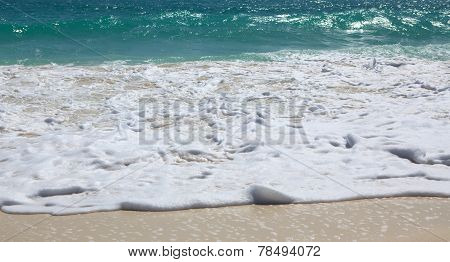 Snow-white foam of the Caribbean Sea. Playa los Cocos. Cayo Larg