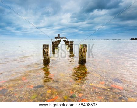 Baltic Rocky Coast With Old Military Buildings From World War Ii And Wooden Breakwaters.