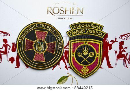 Illustrative editorial.Chevron of Ukrainian National Guard.With logo Roshen Inc. Trademark Roshen is property of ukrainian president Poroshenko.At April 16,2015 in Kiev, Ukraine