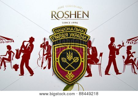 Illustrative editorial.Chevron of Ukrainian National Guard.With logo Roshen Inc. Trademark Roshen is property of ukrainian president Poroshenko.At April 16,2015 in Kiev, Ukraine