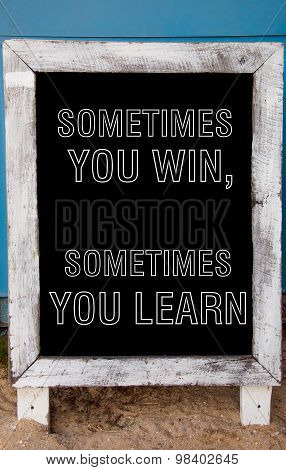 Sometimes You Win, Sometimes You Learn Message Written On Vintage Chalkboard