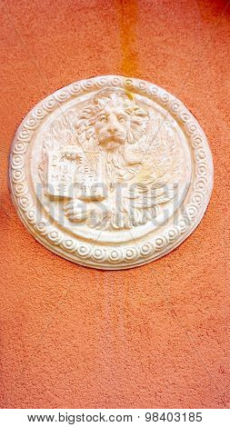 Lion In Circular Shape Bas Relief Art On Orangel Wall
