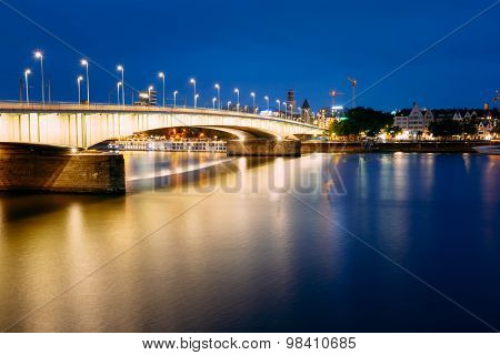 Night View Of Deutz Suspension Bridge Over River Rhine, Germany.