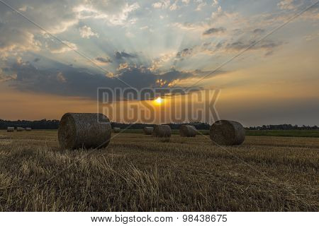 Sheaves of hay in the glow of the sunrise