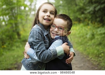 Portrait of two cute little child outdoors on the nature